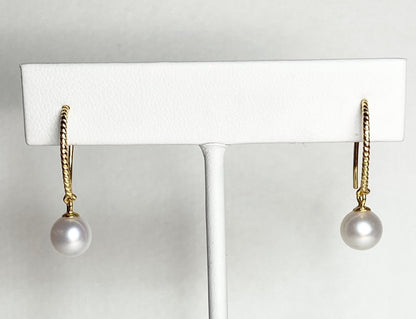 Gold plated sterling silver dangle earrings with 7mm cultured pearls and twisted wire hooks.
