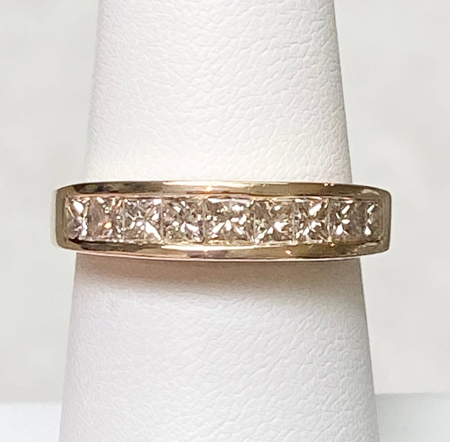 14k yellow gold anniversary band with princess cut diamonds.