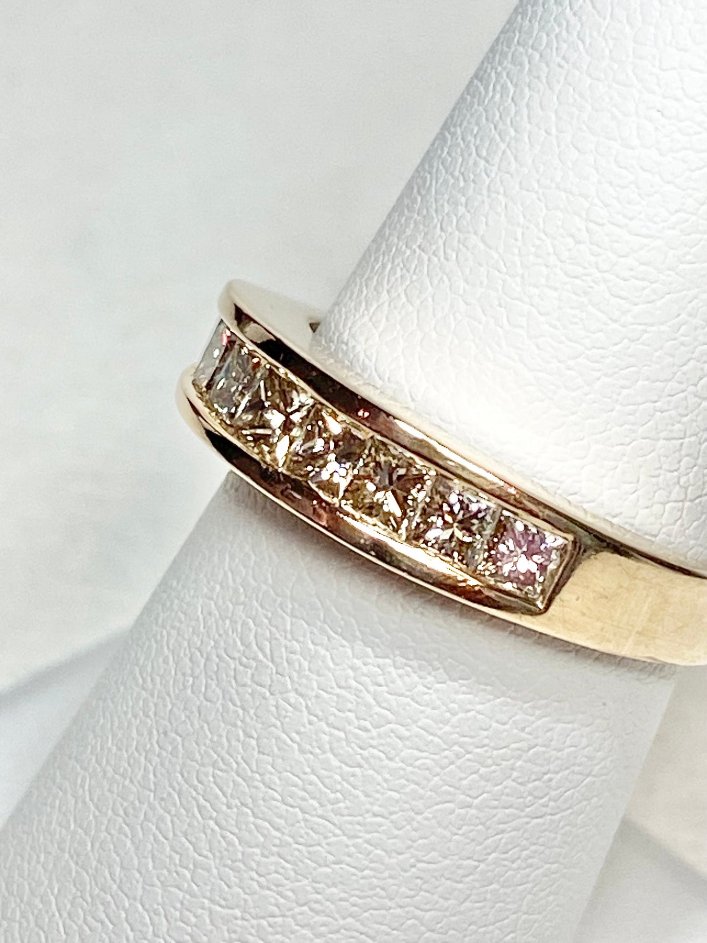 14k yellow gold anniversary band with princess cut diamonds.
