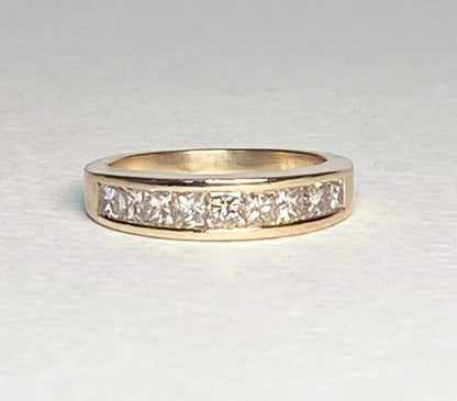 14k yellow gold anniversary band with princess cut diamonds.