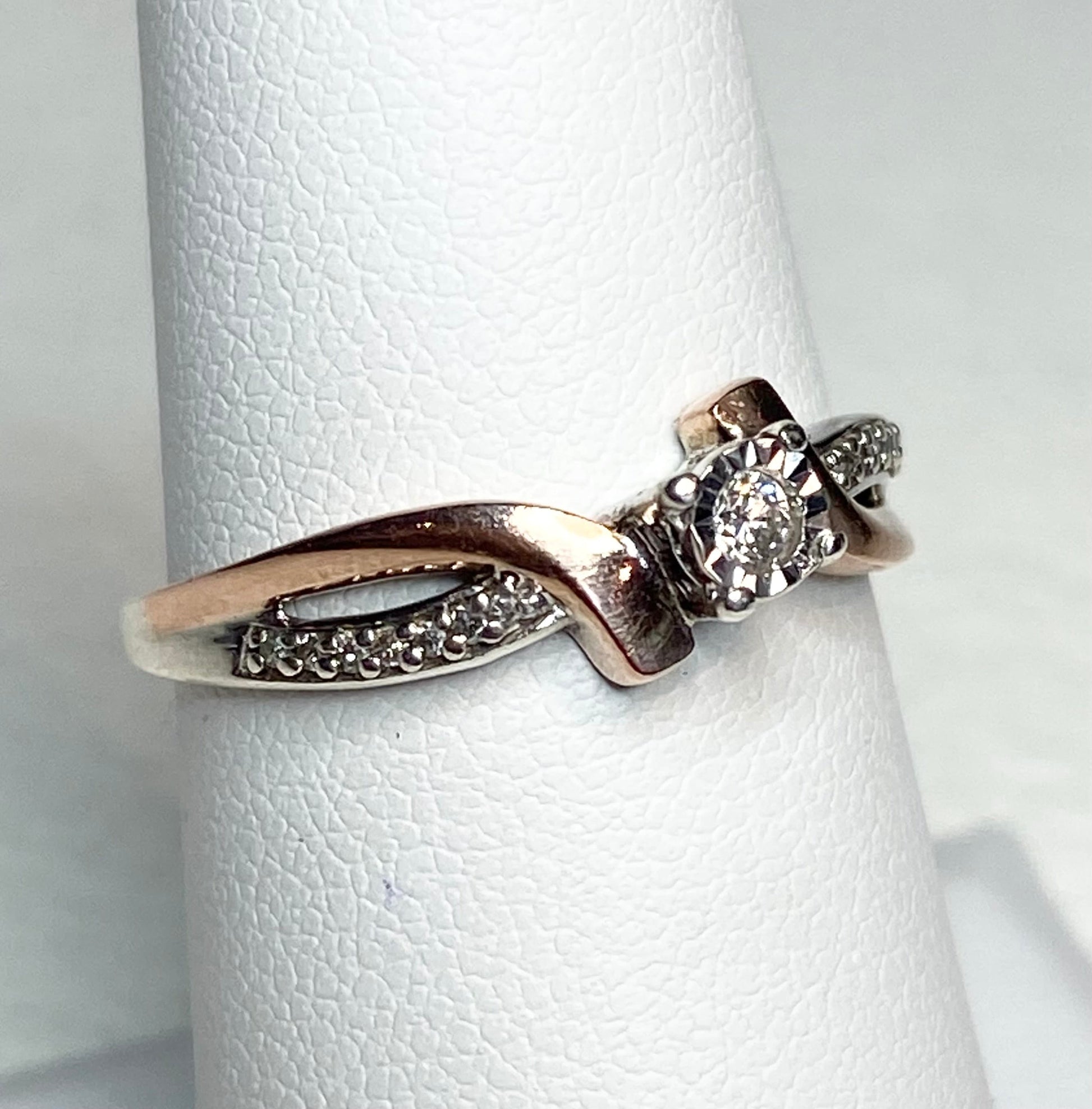 10k rose gold and sterling silver bypass ring with diamonds.