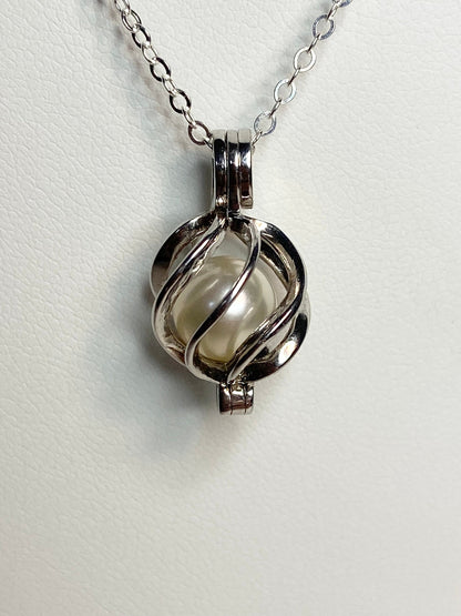 Sterling silver pendant necklace with a 7.8mm Akoya pearl in a cage.