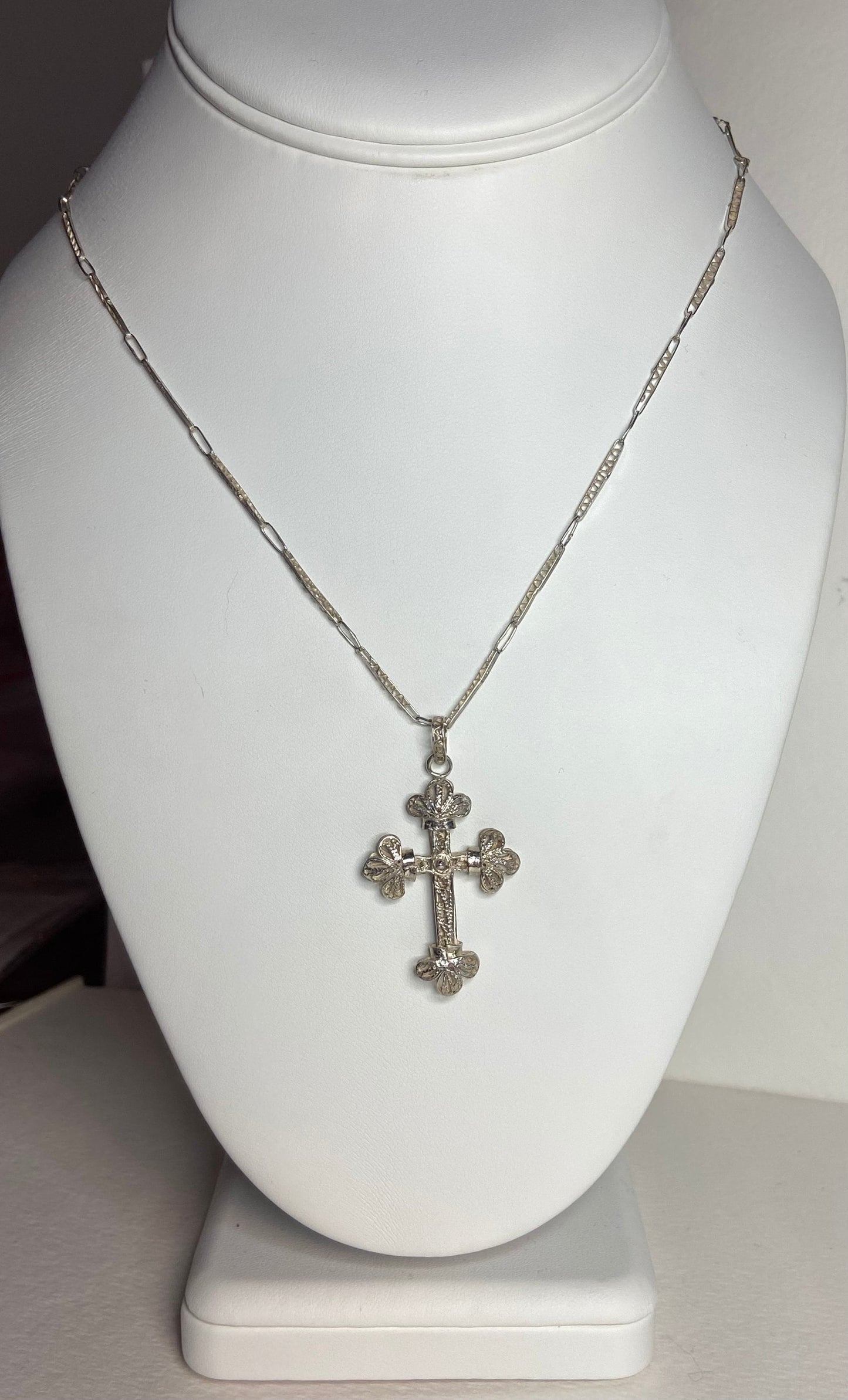 Antique filigree sterling silver cross pendant on a matching chain.