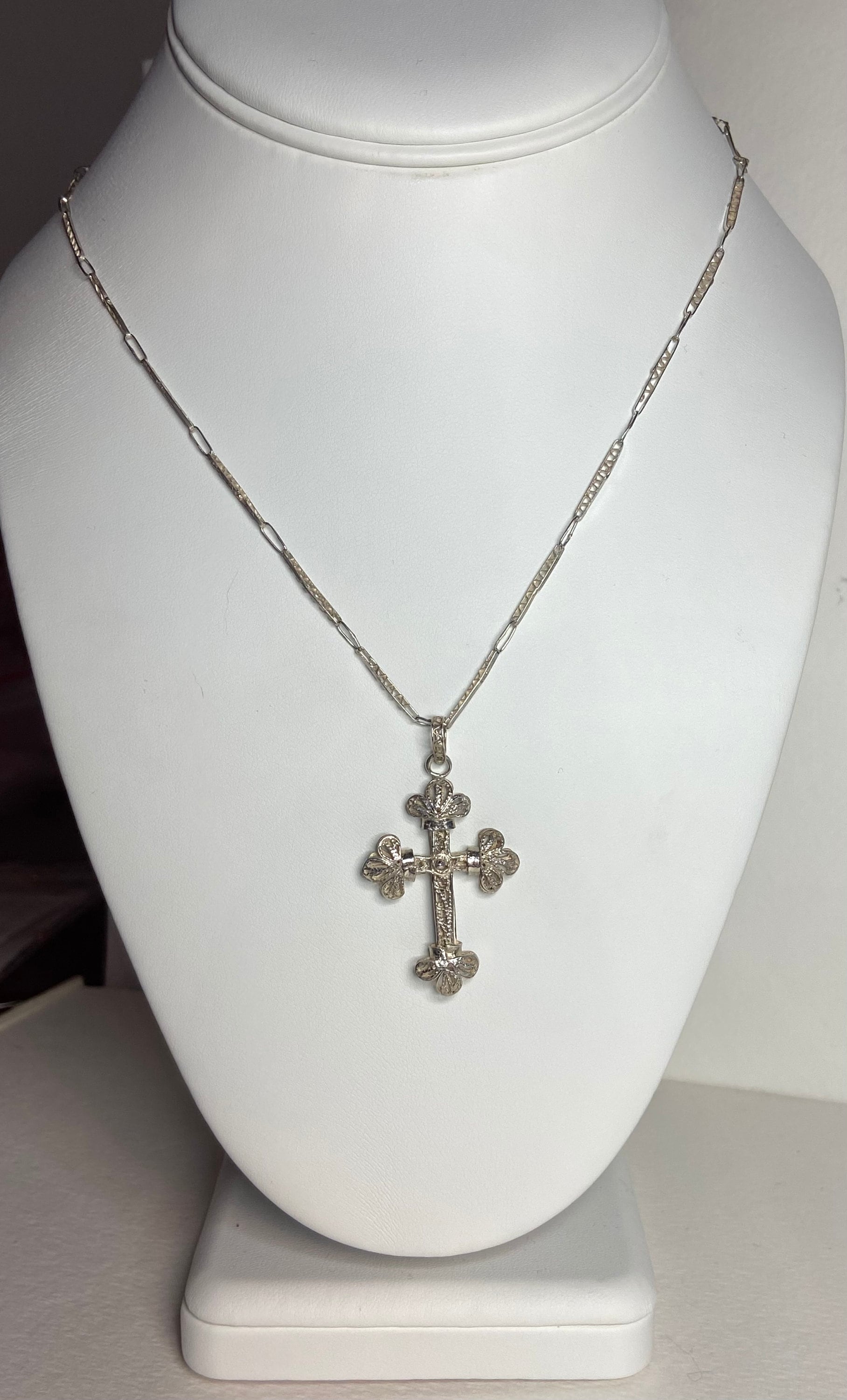 Antique filigree sterling silver cross pendant on a matching chain.