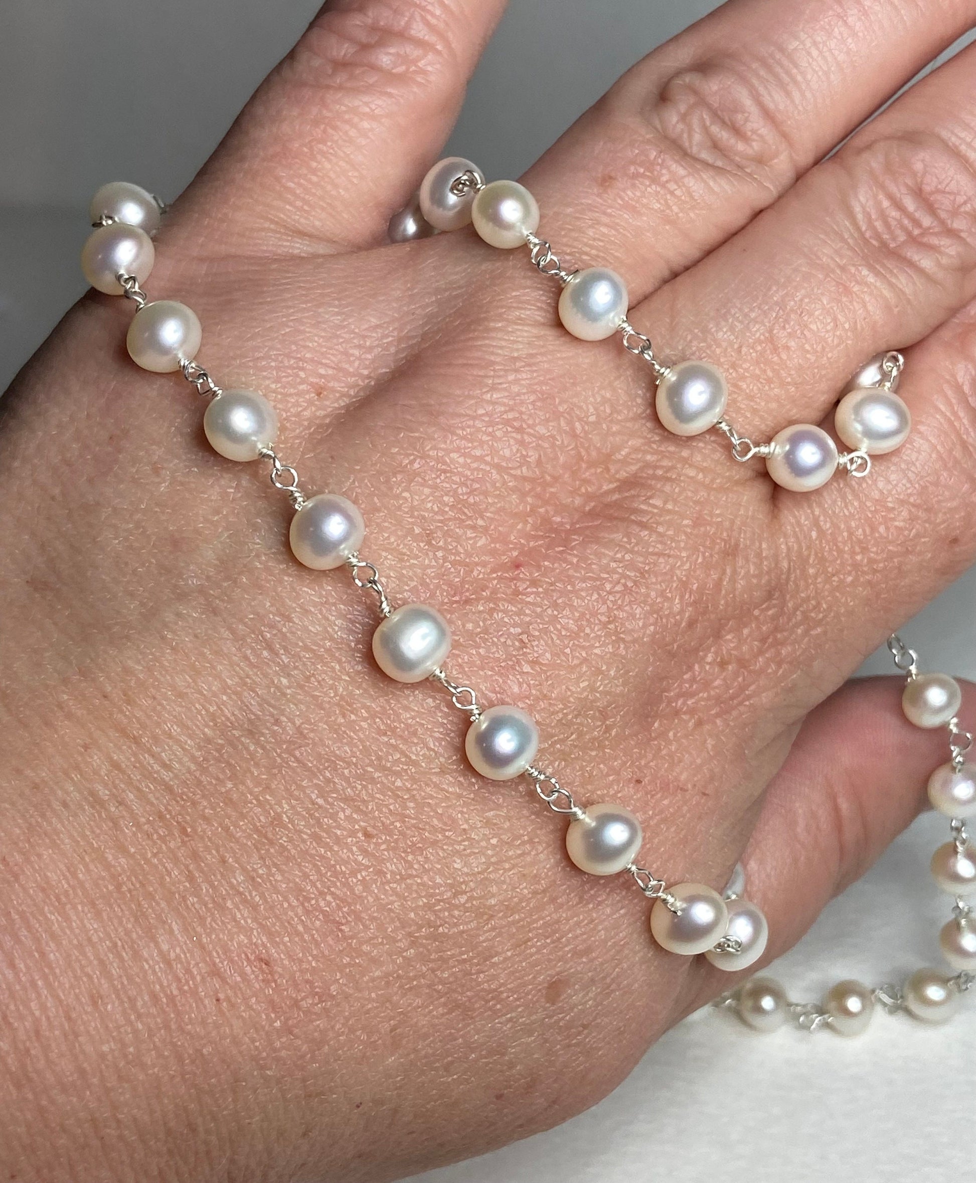 A 19-inch sterling silver necklace with lustrous freshwater pearls.