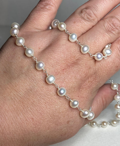A 19-inch sterling silver necklace with lustrous freshwater pearls.