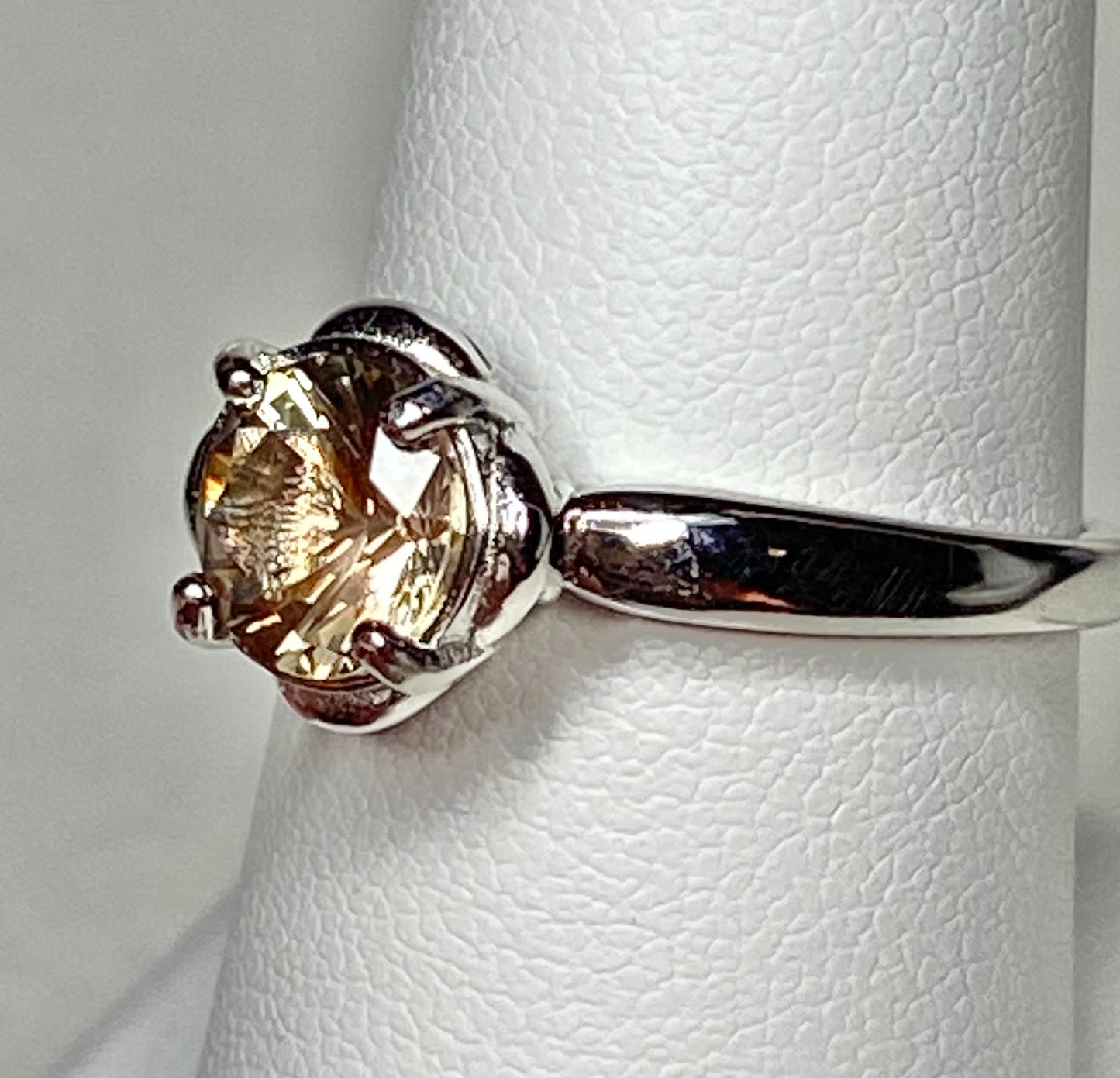 Sterling silver solitaire ring with a round dichroic Oregon sunstone.