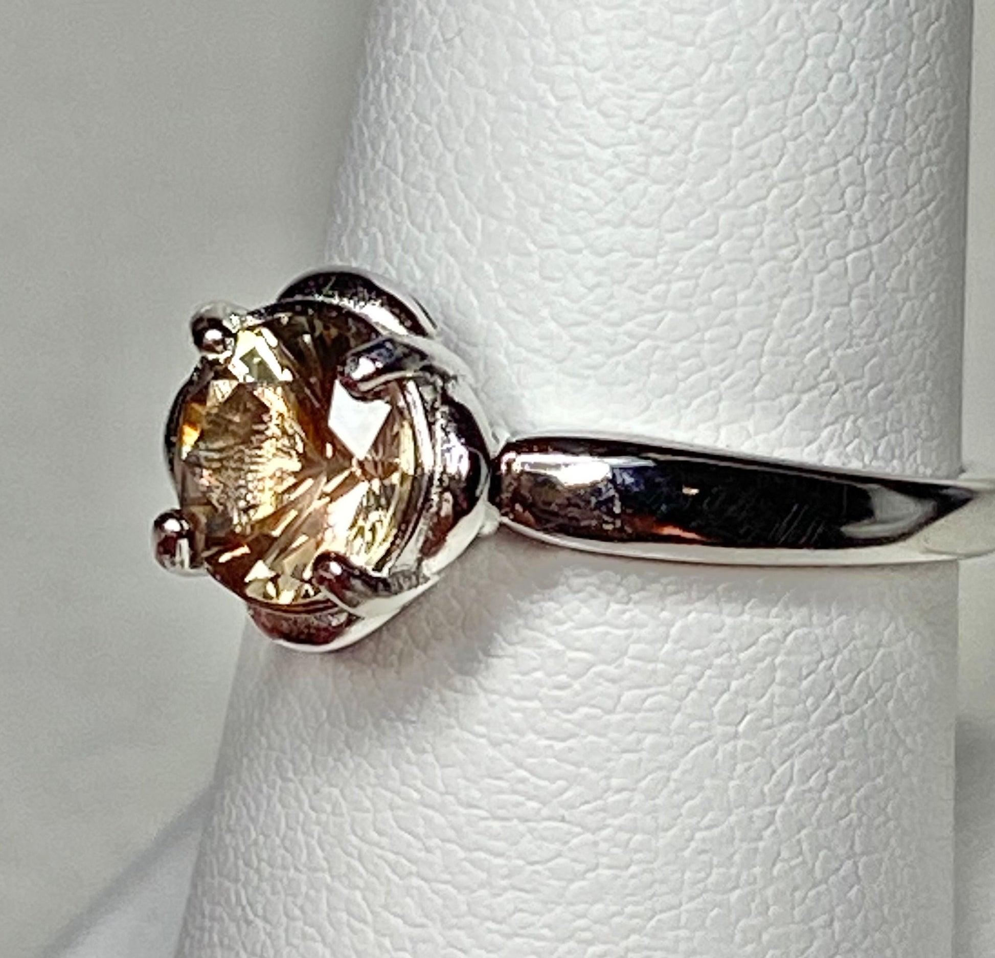 Sterling silver solitaire ring with a round dichroic Oregon sunstone.
