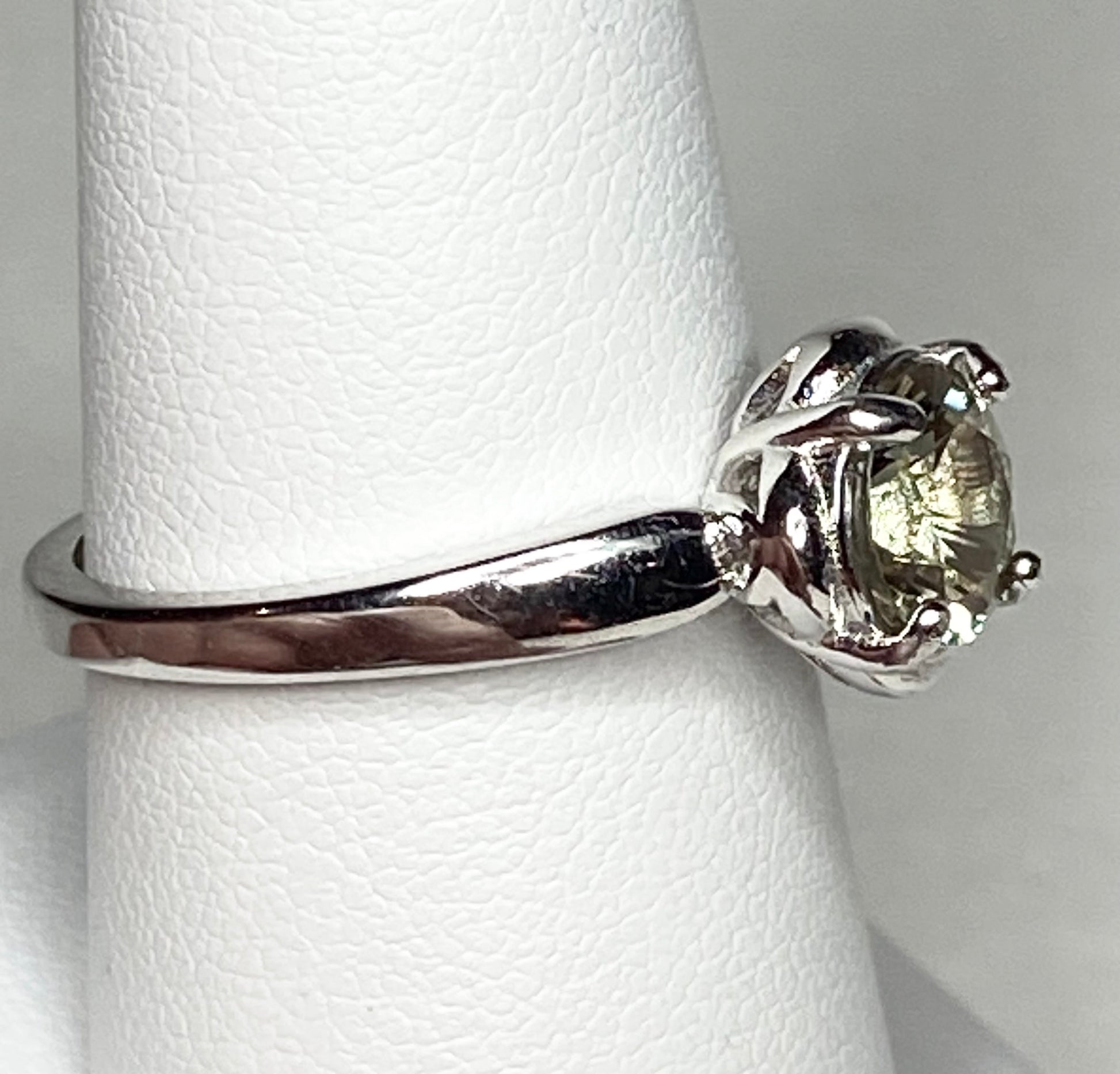 Sterling silver solitaire ring with a color-shifting Oregon Sunstone.