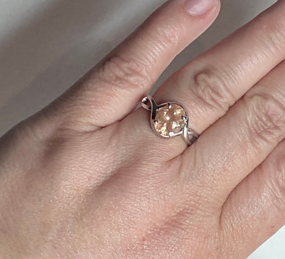 Peach Oregon Sunstone oval solitaire ring in sterling silver.