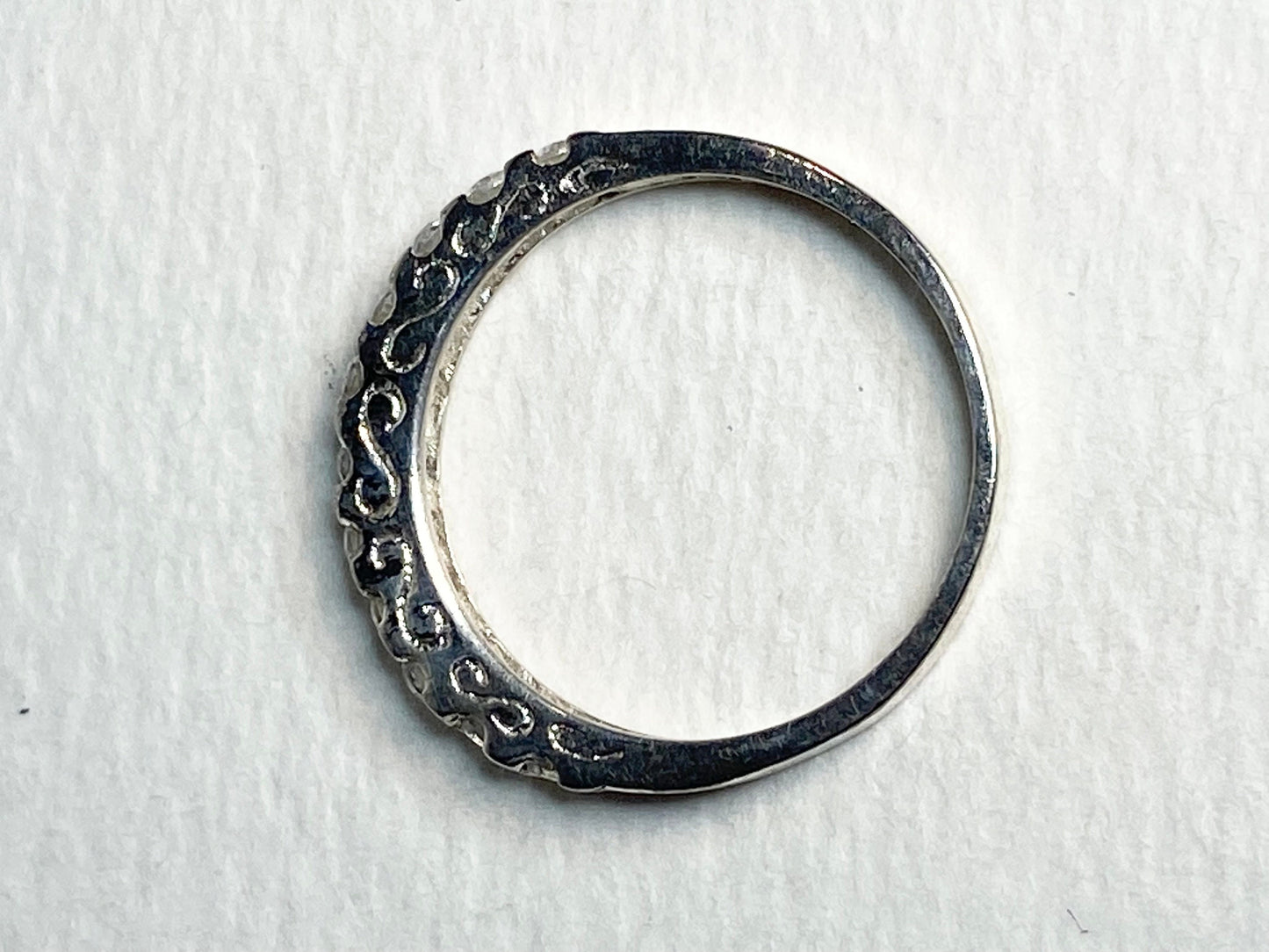 Silver anniversary stackable band ring with cz crystals.