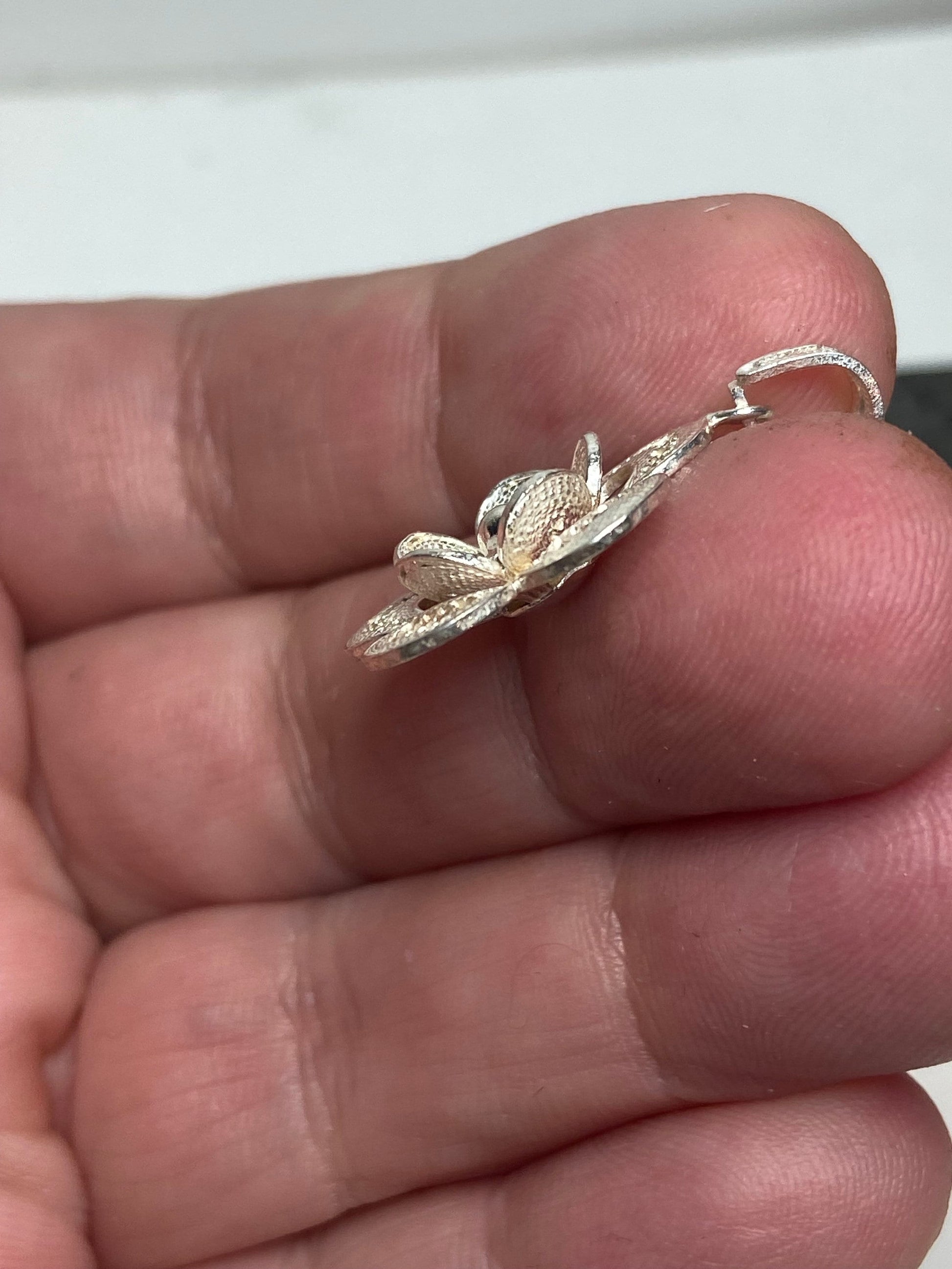 Beautiful handmade sterling silver filigree flower pendant.