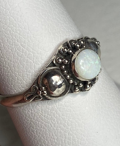 Handmade sterling silver ring with a round Australian opal.