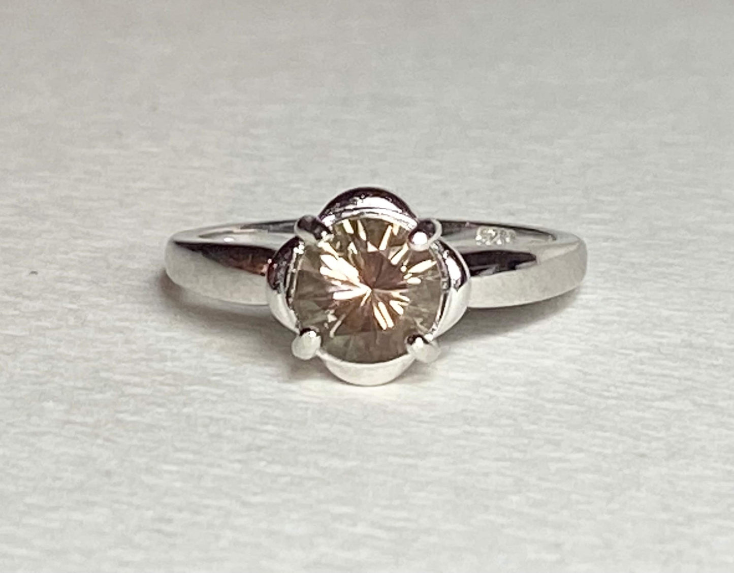 Sterling silver ring with a 1.18ct round Oregon Sunstone solitaire.