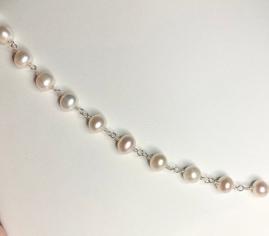 Lustrous genuine cultured freshwater pearls on a sterling silver chain.