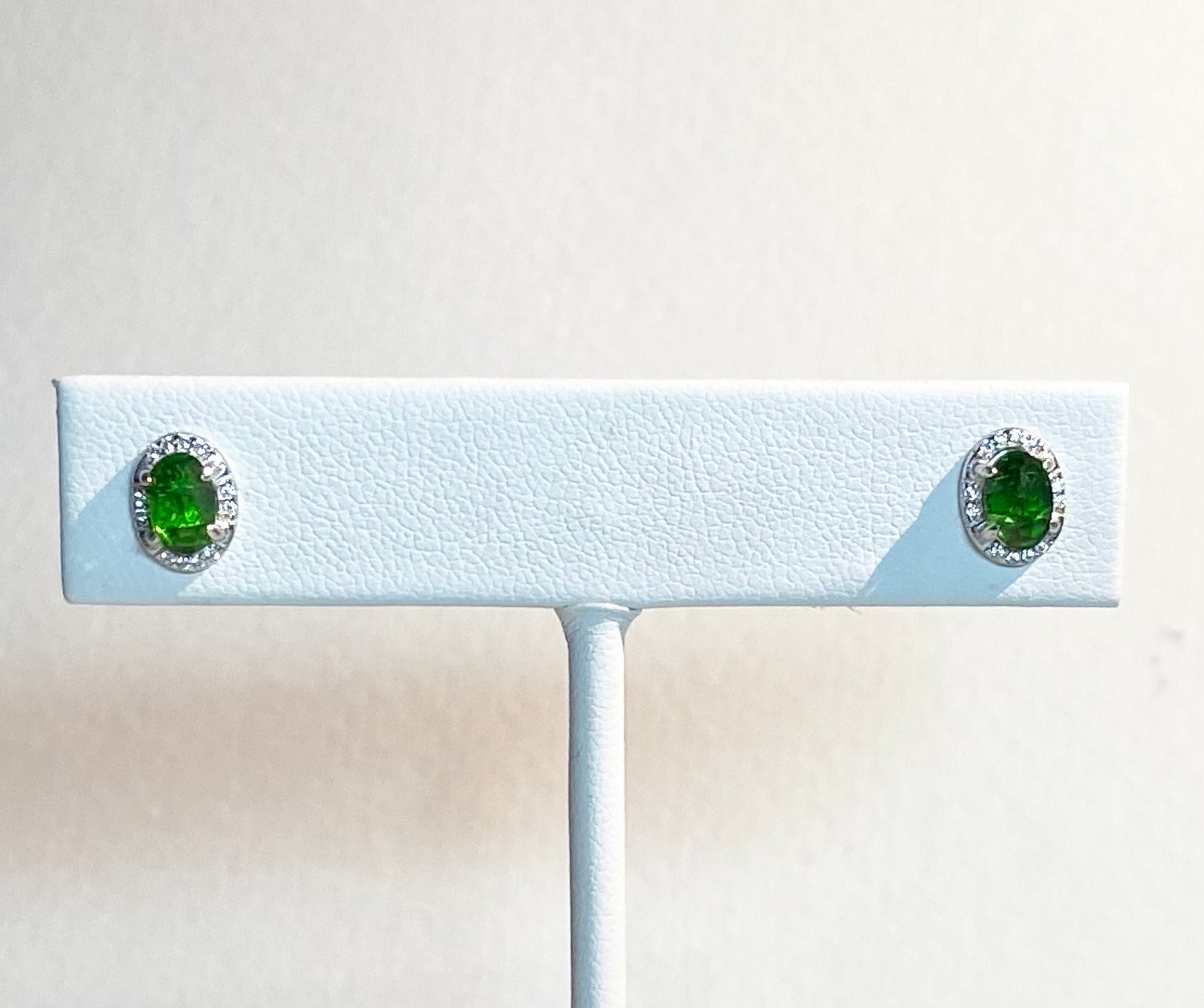Chrome diopside and cubic zirconia halo stud earrings in sterling silver.