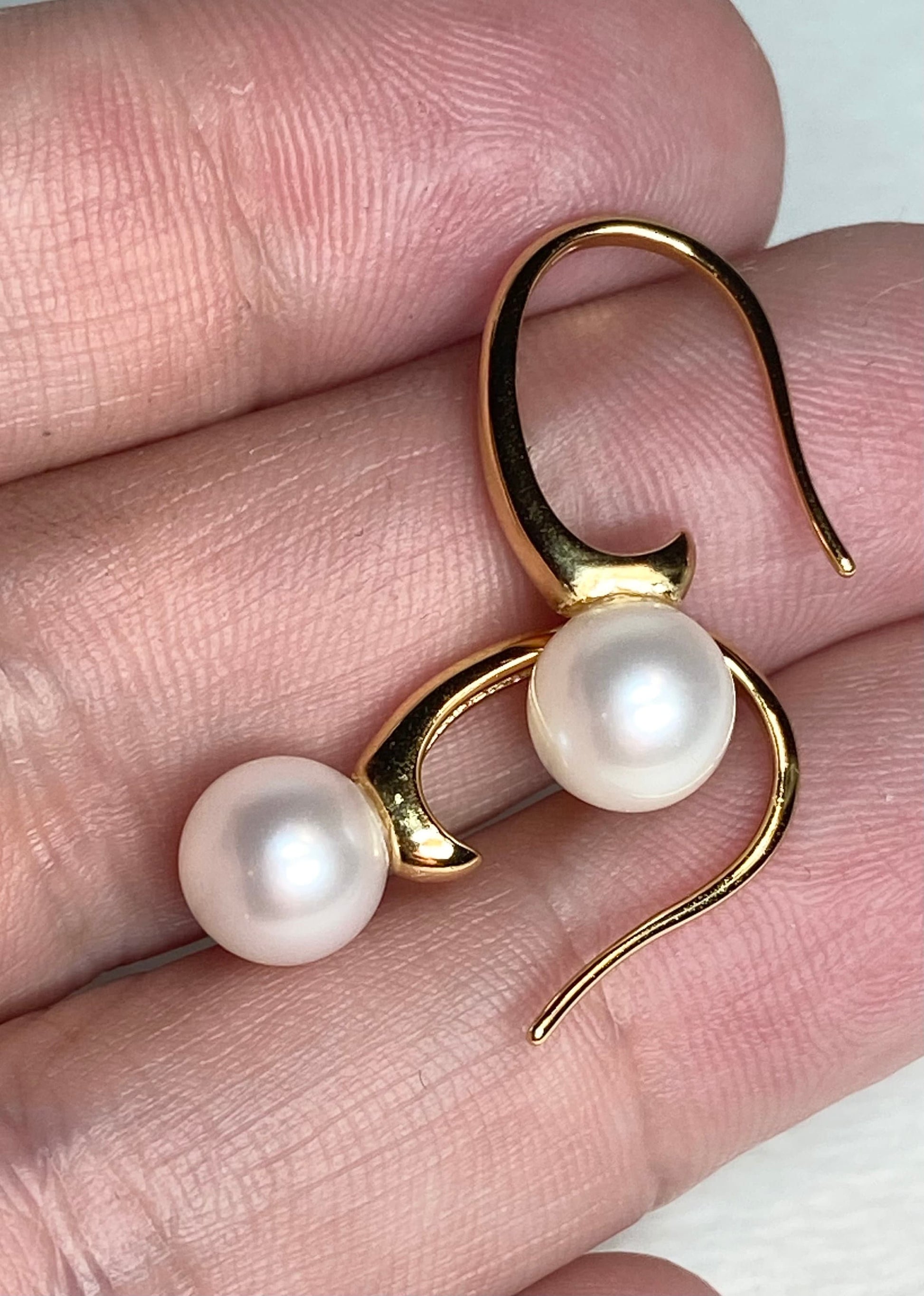 Gold vermeil drop earrings with two 7mm cultured pearls.