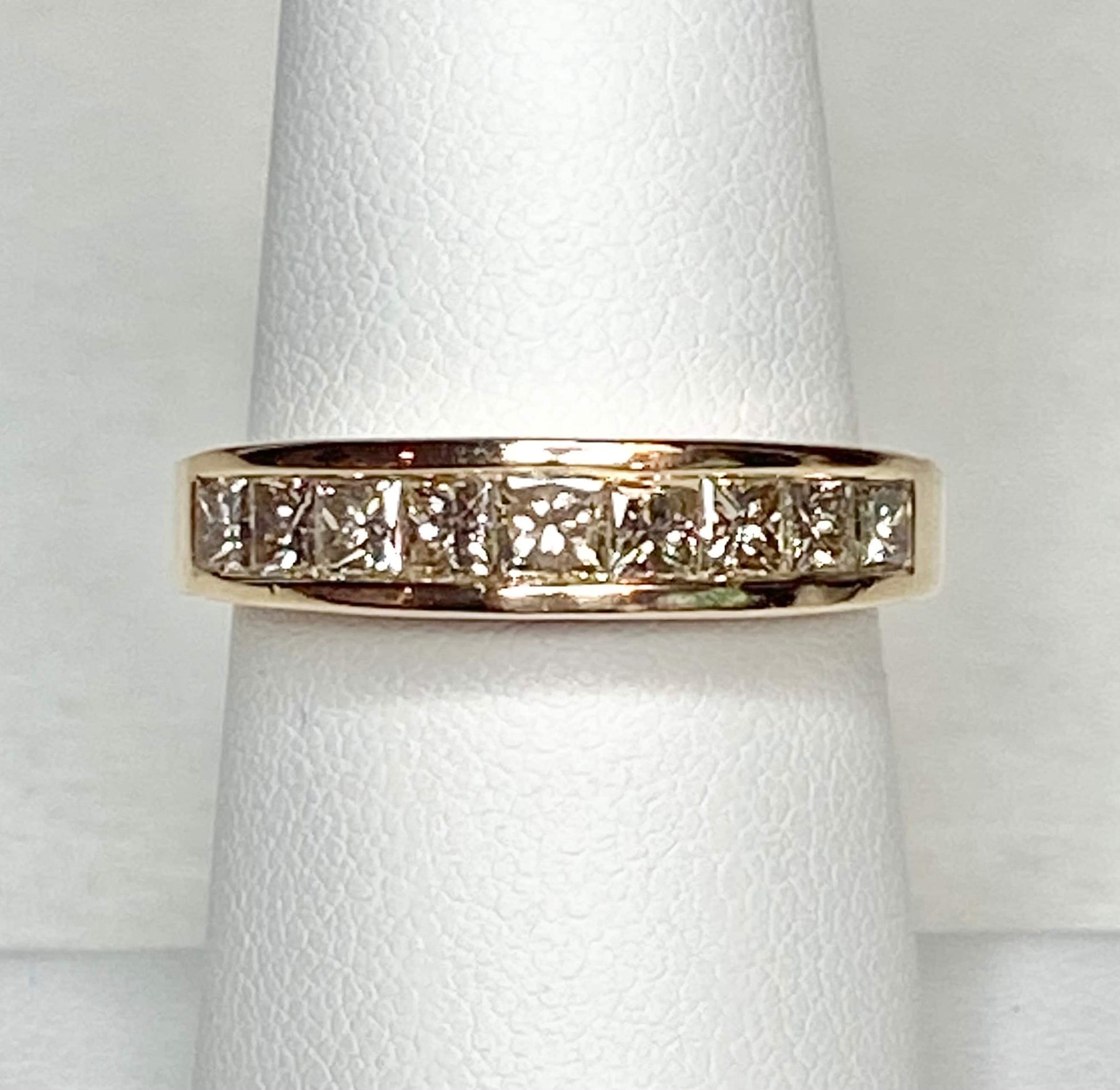 14k yellow gold anniversary band with princess cut diamonds.