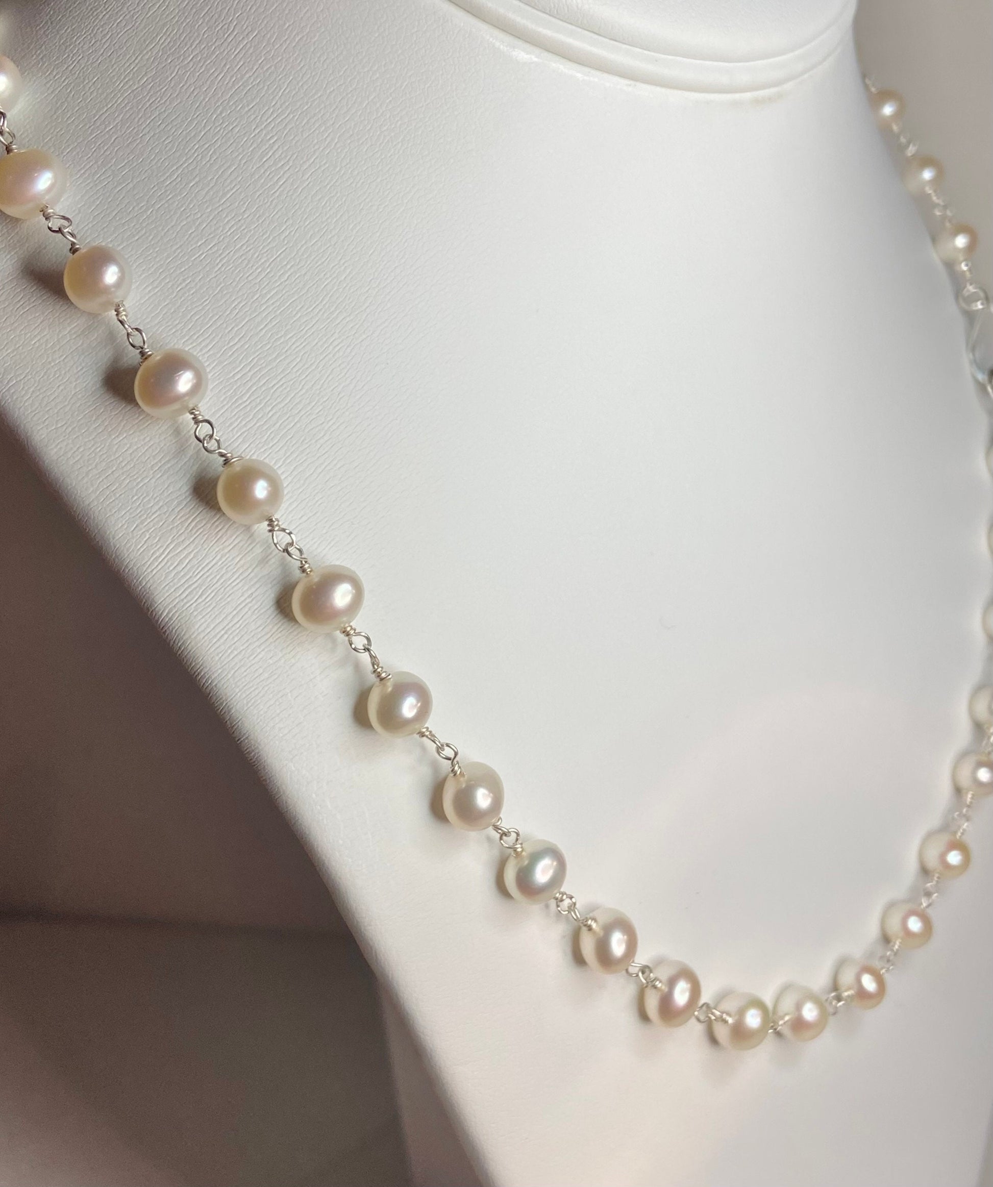 Lustrous genuine cultured freshwater pearl necklace in solid sterling silver.