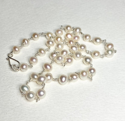 Lustrous genuine cultured freshwater pearls with a sterling silver clasp.