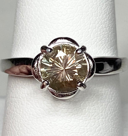 Sterling silver ring with a round, color-shifting Oregon Sunstone solitaire.