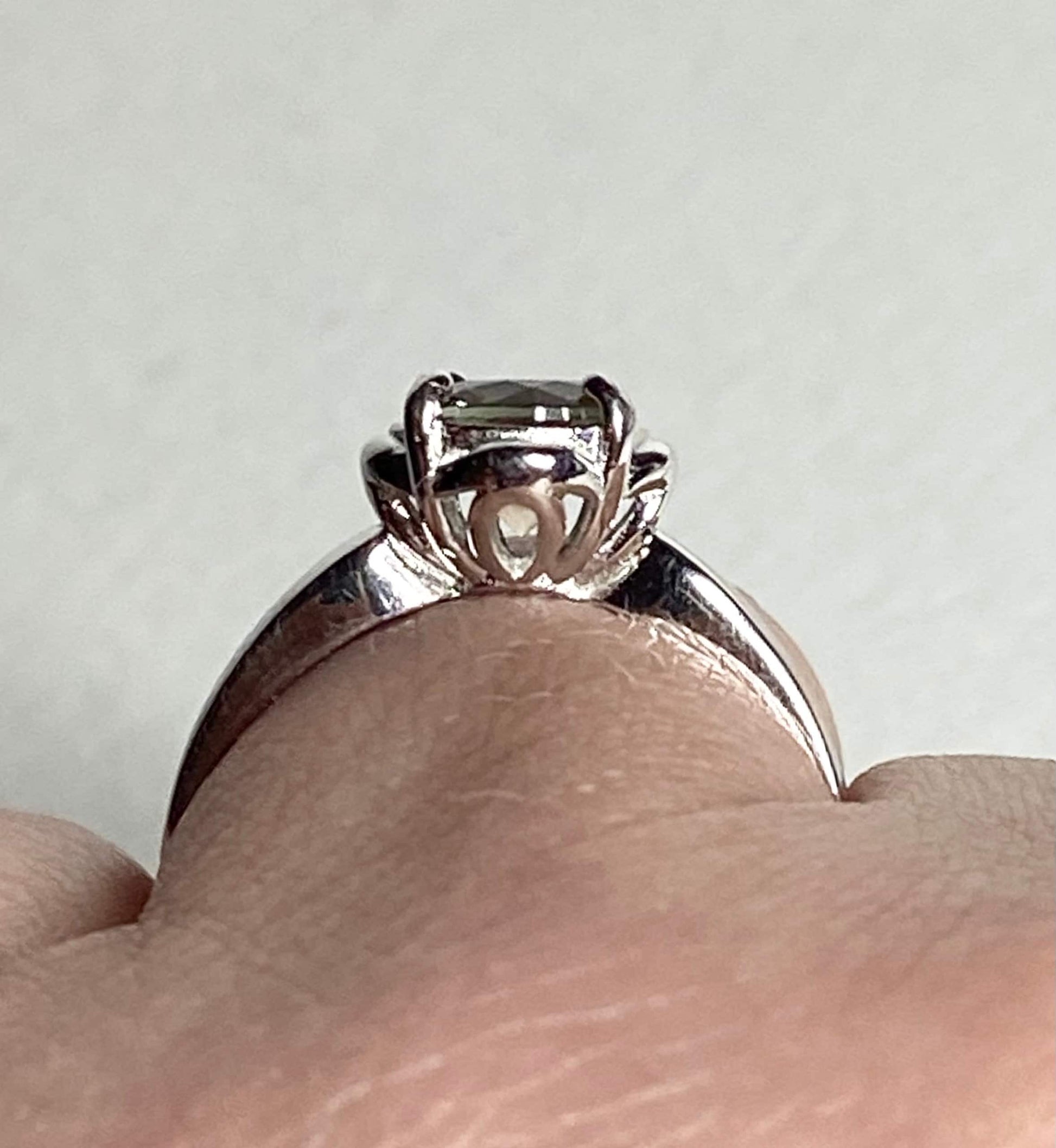 Sterling silver ring with a color-shifting Oregon Sunstone solitaire.