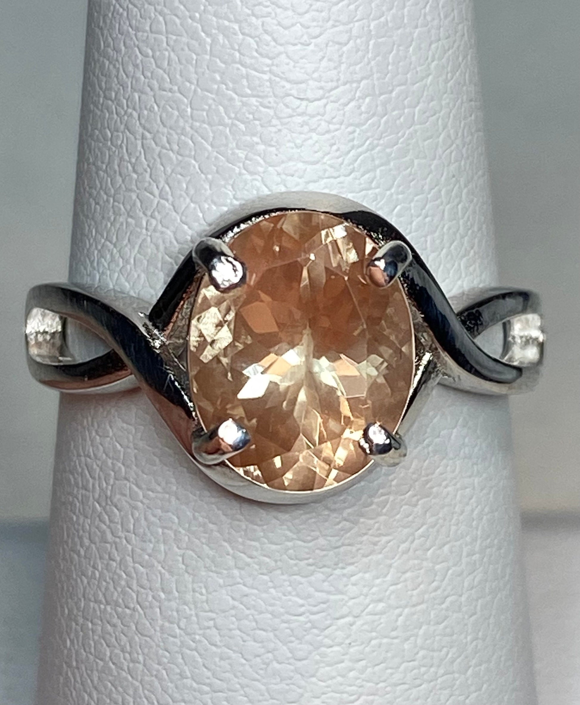 Peach Oregon Sunstone oval solitaire ring in sterling silver.