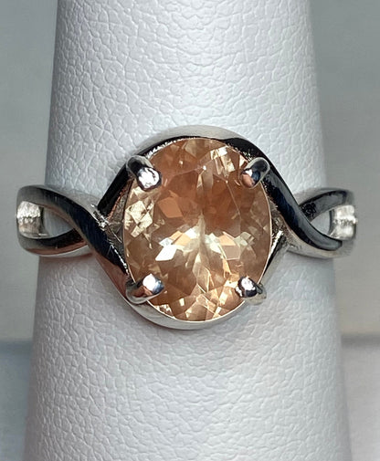Peach Oregon Sunstone oval solitaire ring in sterling silver.