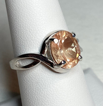 Peach Oregon Sunstone oval solitaire ring in sterling silver.