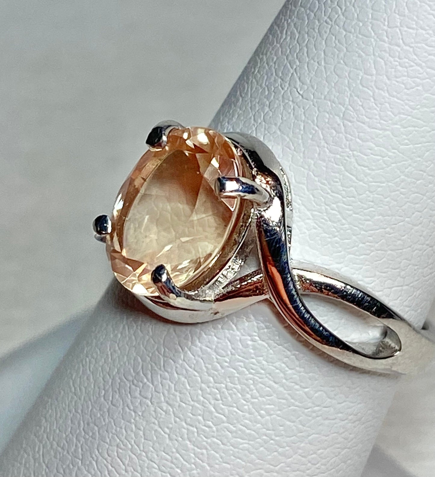 Peach Oregon Sunstone oval solitaire ring in sterling silver.