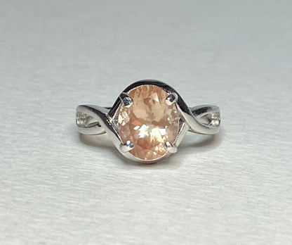 Sterling silver ring with an 8x10mm oval peach Oregon sunstone.