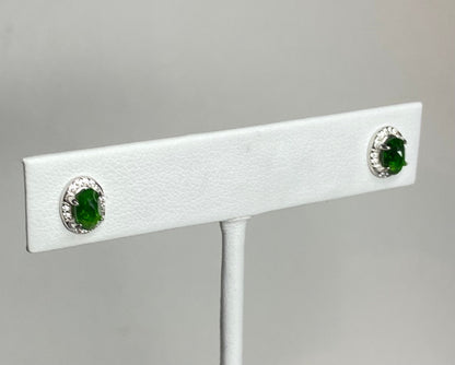 Sterling silver stud earrings with oval chrome diopside and cz accents.