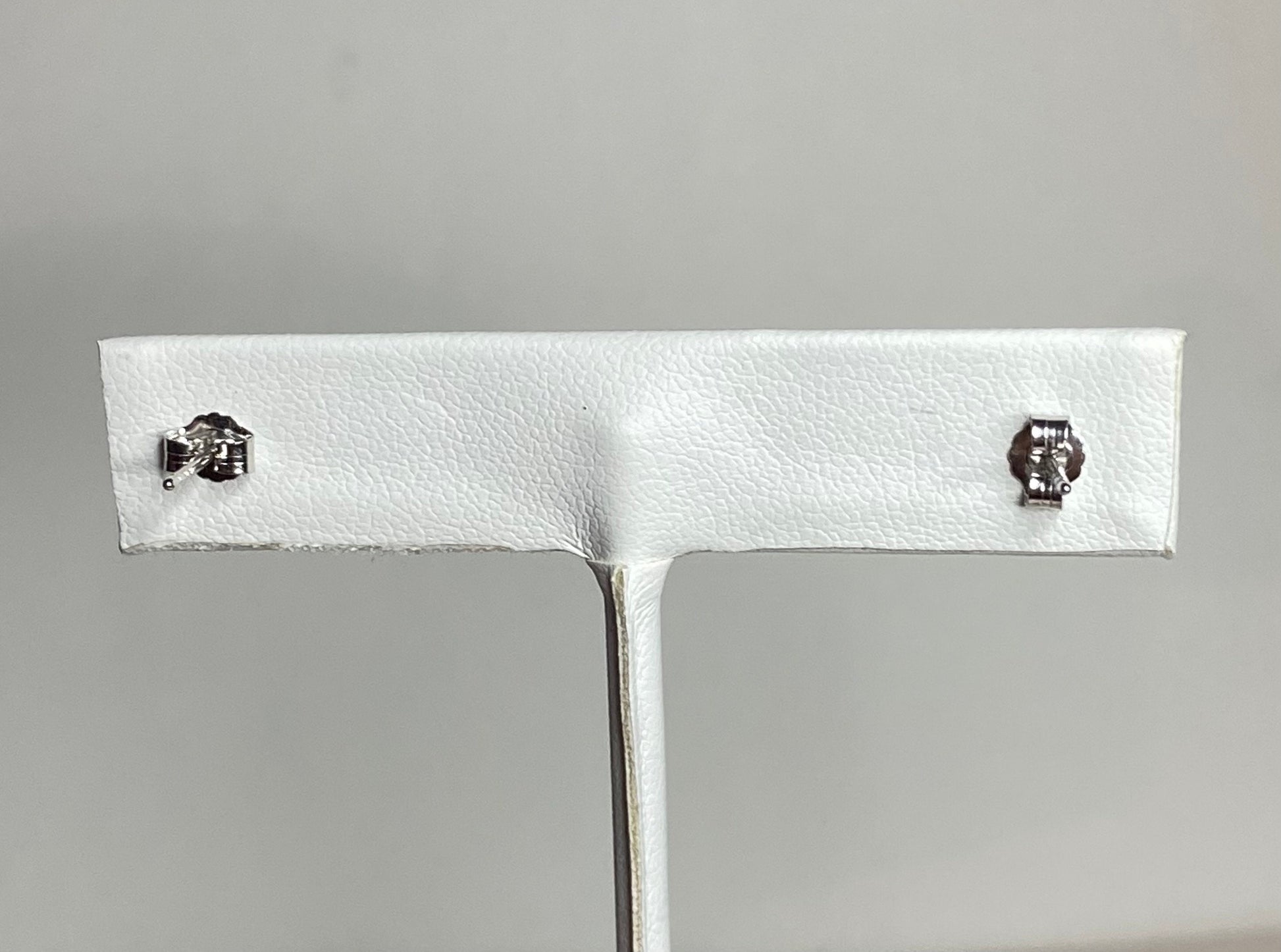 Sterling silver stud earrings with chrome diopside and cubic zirconia.