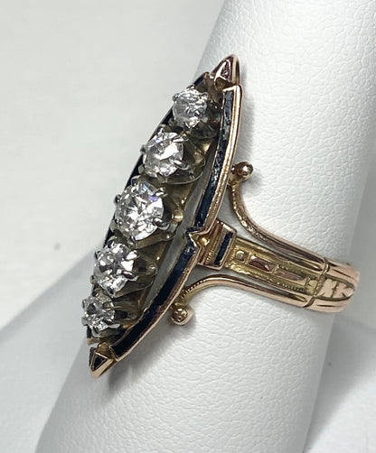 Antique Victorian navette ring with five old mine cut diamonds and black enamel on 14k gold.
