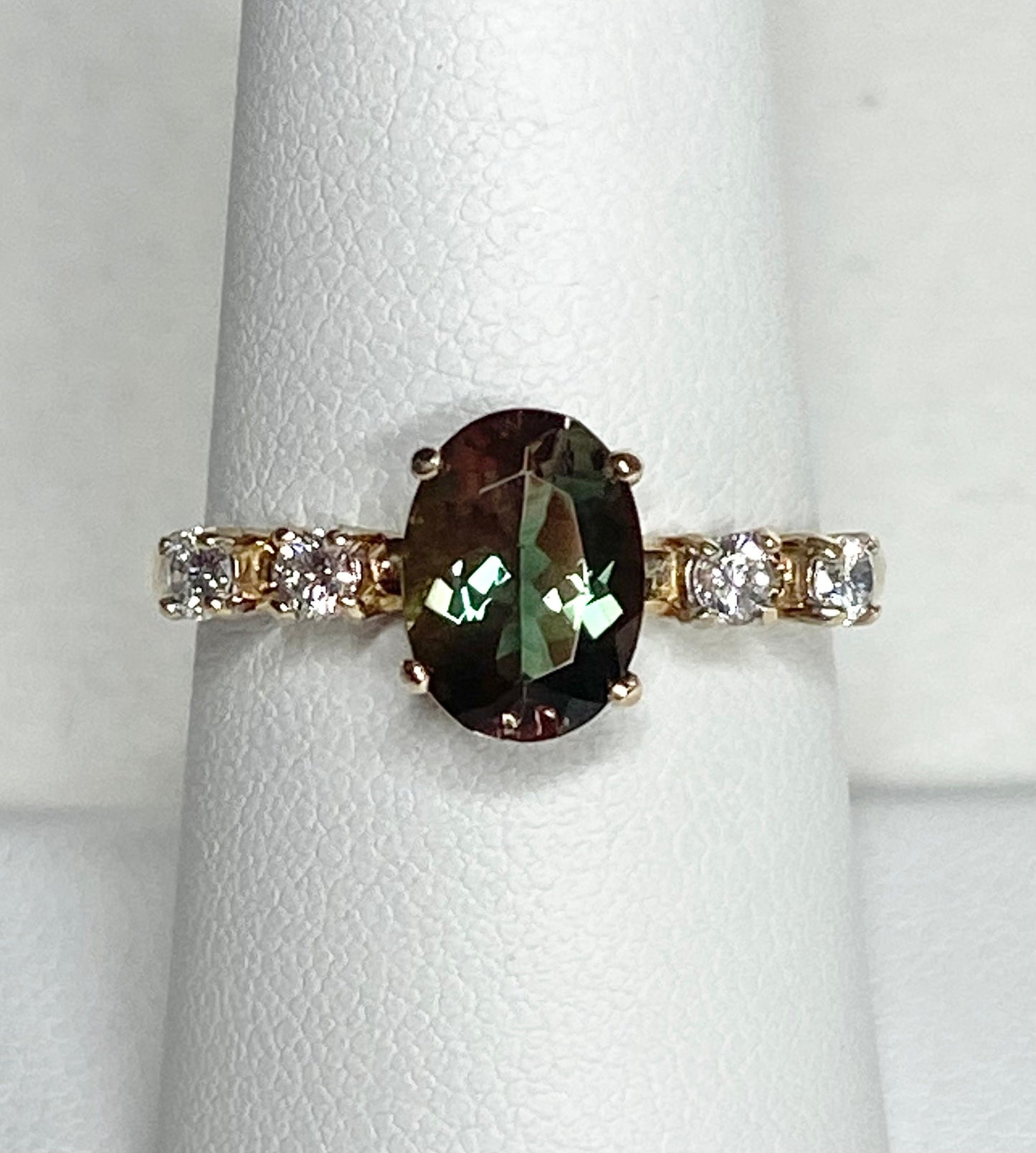 Oval Oregon sunstone and diamond ring in 10k yellow gold.
