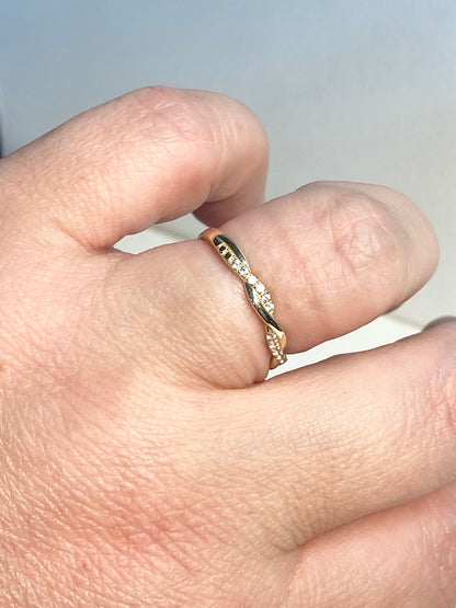 Solid 10k gold twist band ring with pave stones.