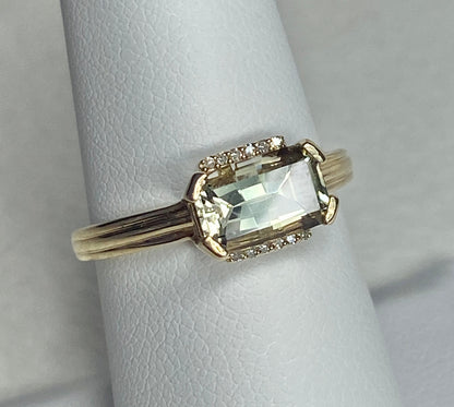 A light green Oregon Sunstone ring with diamonds in 10k yellow gold.