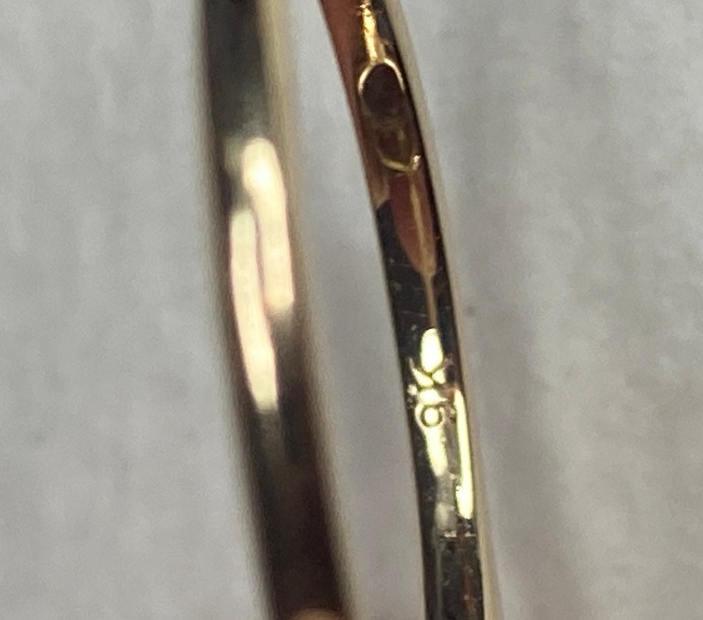 A 9k yellow gold ring with a prasiolite green quartz and zircon stones.