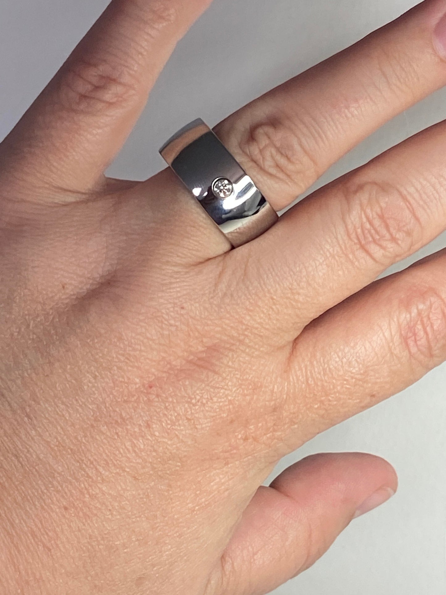 Hefty cobalt band ring with a single diamond, size 10.