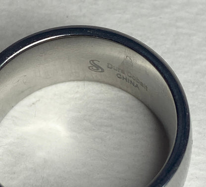 A wide, silver-toned ring with "Dura Cobalt CHINA" inscribed inside.