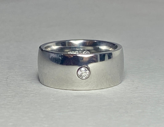 Hefty cobalt band ring with a single diamond, size 10.