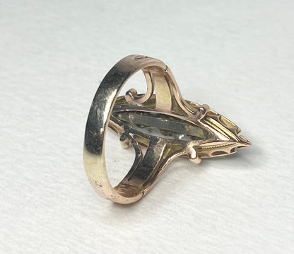 Antique Victorian navette ring with diamonds and black enamel in 14k gold.
