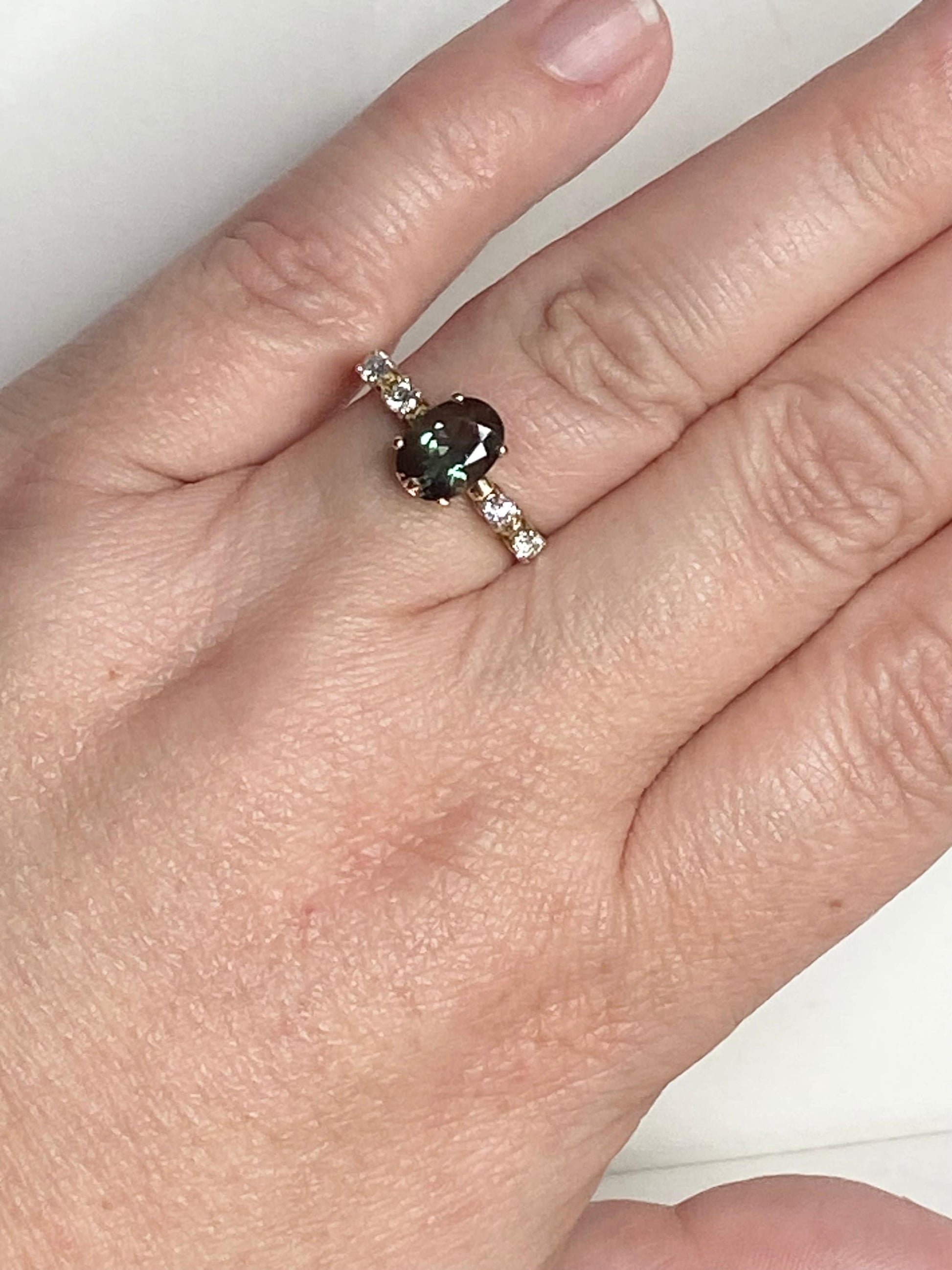 Green Oregon Sunstone and diamond ring in 10k yellow gold.