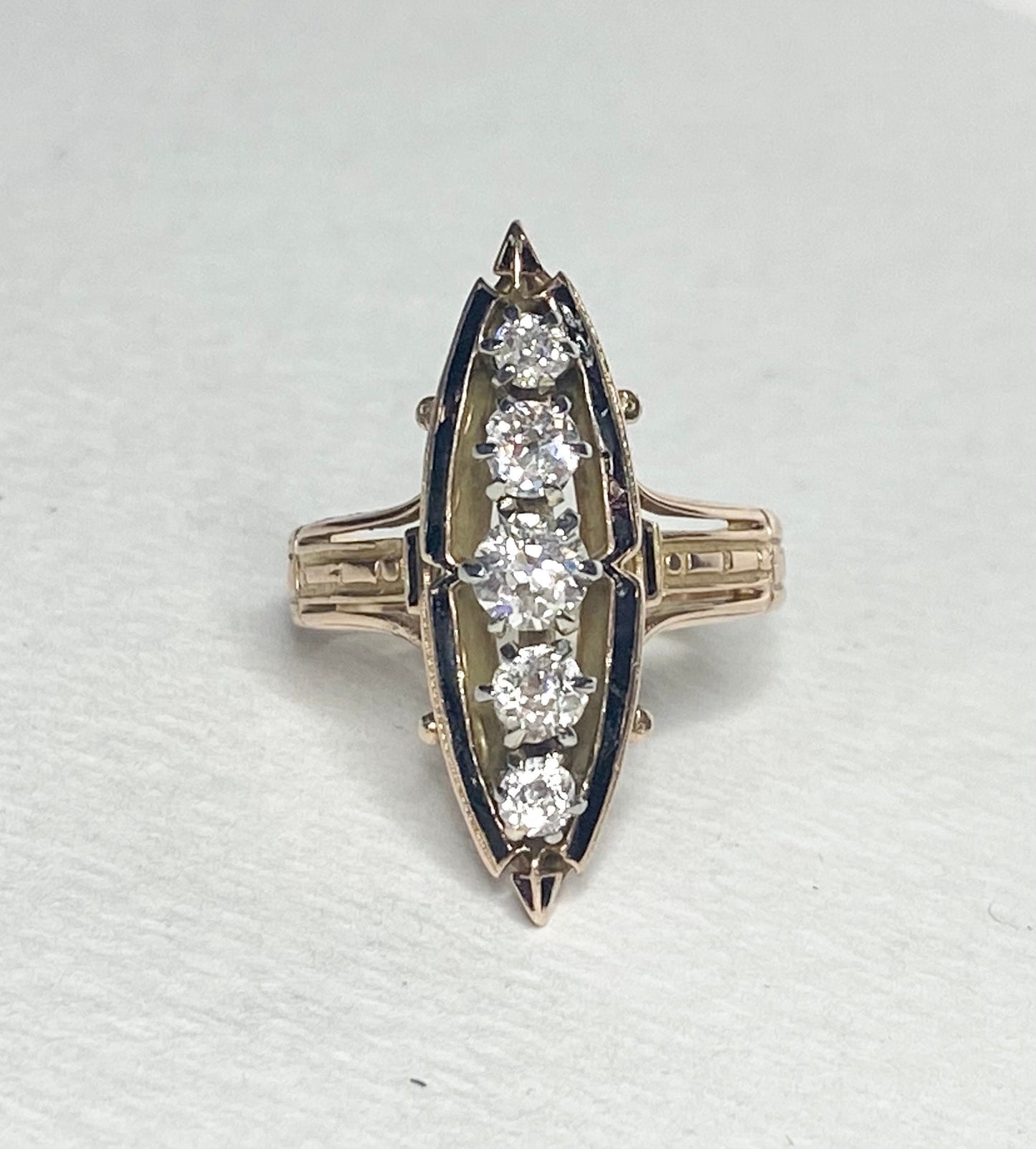 Antique Victorian navette ring with five old mine cut diamonds and black enamel.