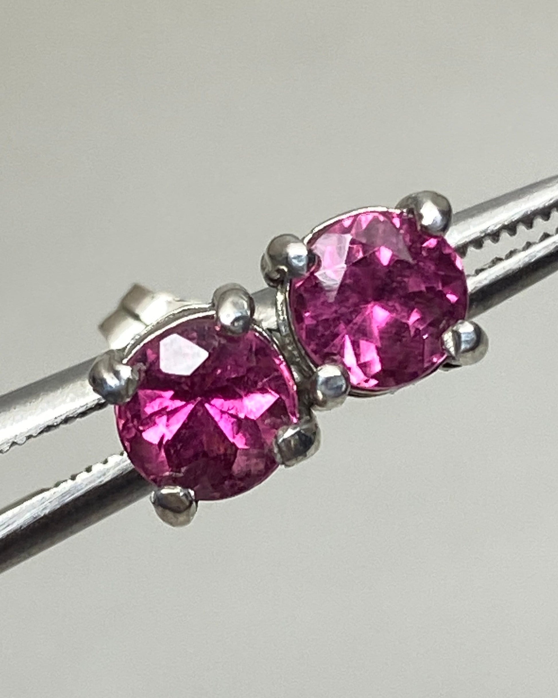 Purplish-pink rubellite tourmaline 5mm stud earrings in solid sterling silver.