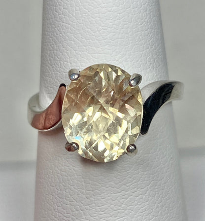 Oval checkerboard faceted Oregon sunstone solitaire ring in sterling silver.