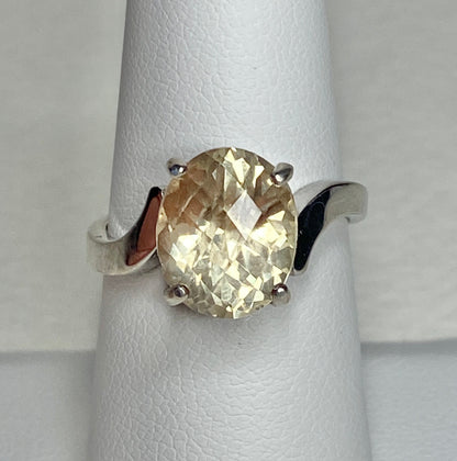 Sterling silver ring with a checkerboard faceted oval Oregon Sunstone.