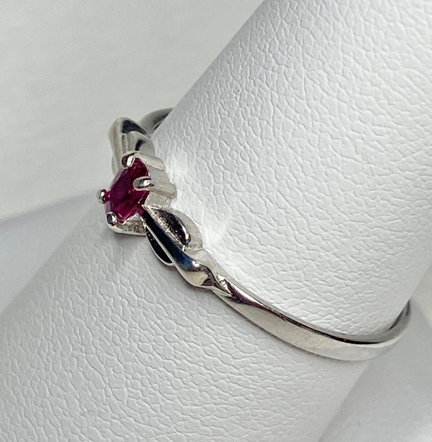 Sterling silver ring with a spade arrowhead design featuring a Burmese ruby.