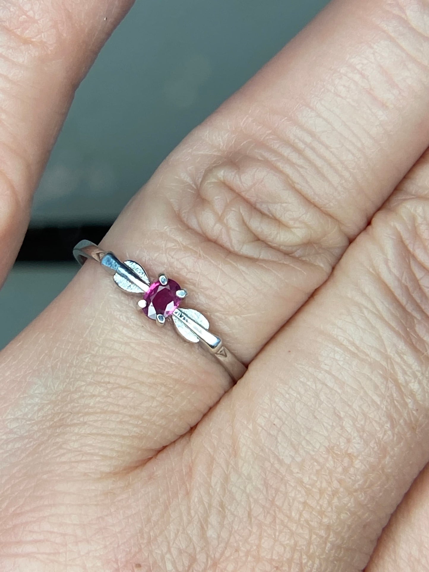 Sterling silver ring with a spade arrowhead design and a Burmese ruby.