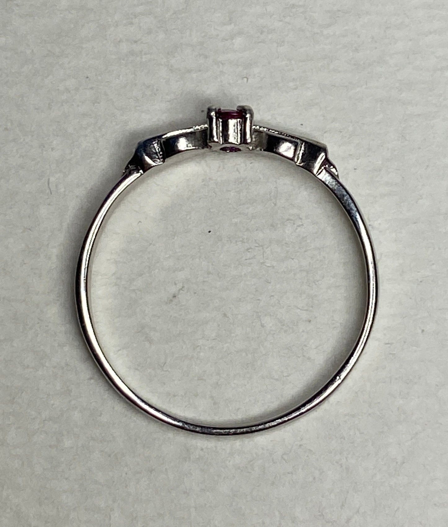 Petite Burmese ruby spade arrowhead design ring in sterling silver.